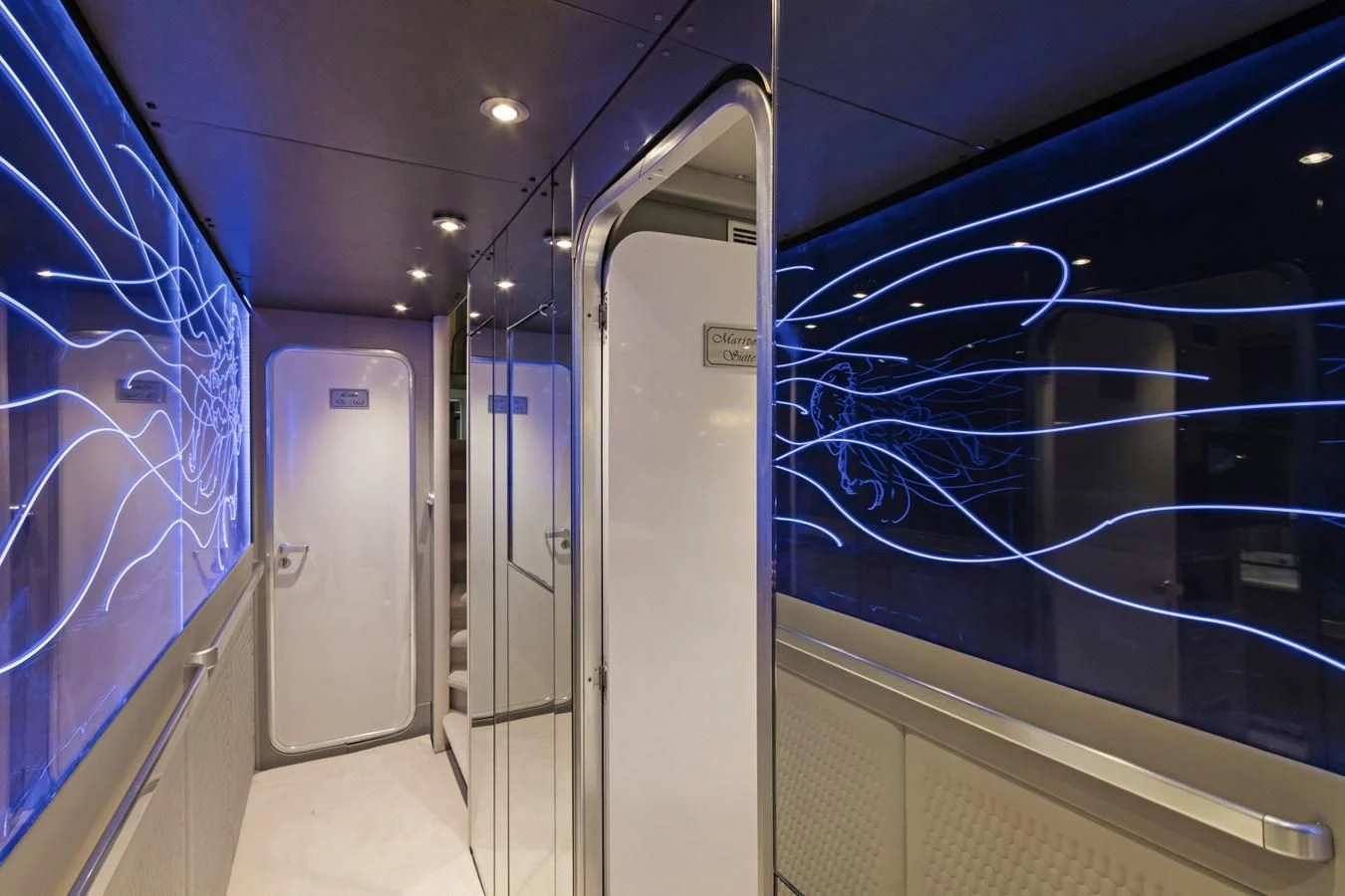 a hallway with glass doors aboard MARY KATHLENE Yacht for Sale