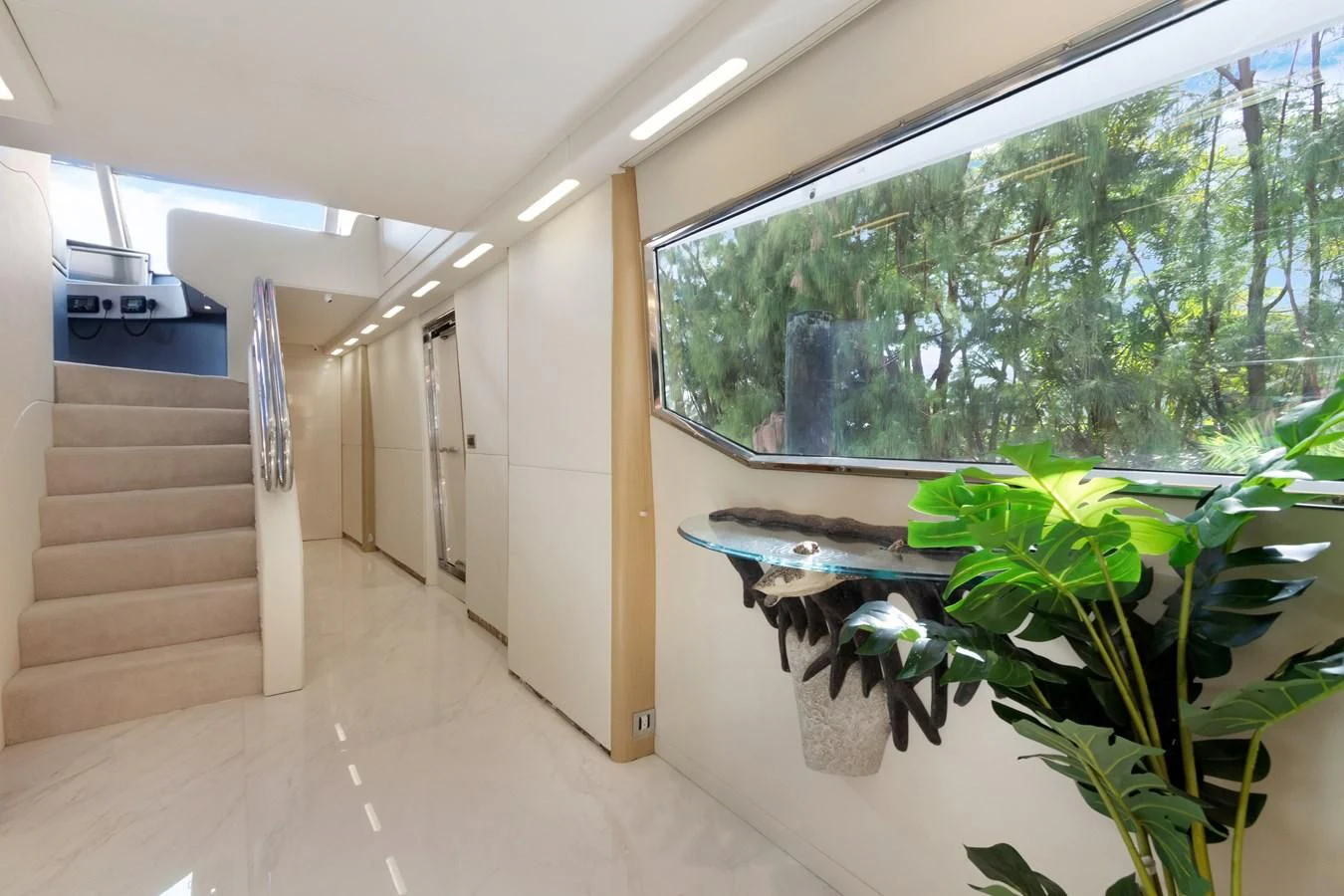 a room with a plant and a staircase aboard MARY KATHLENE Yacht for Sale