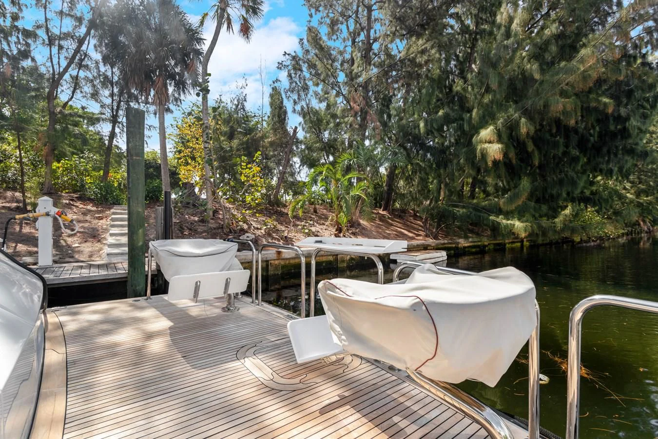 a deck with chairs and tables on it aboard MARY KATHLENE Yacht for Sale