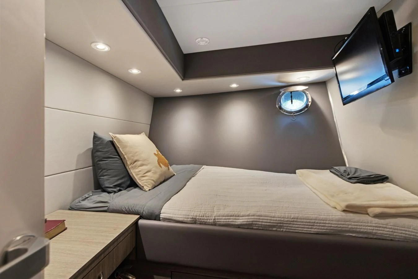 a bedroom with a bed and a television aboard MARY KATHLENE Yacht for Sale