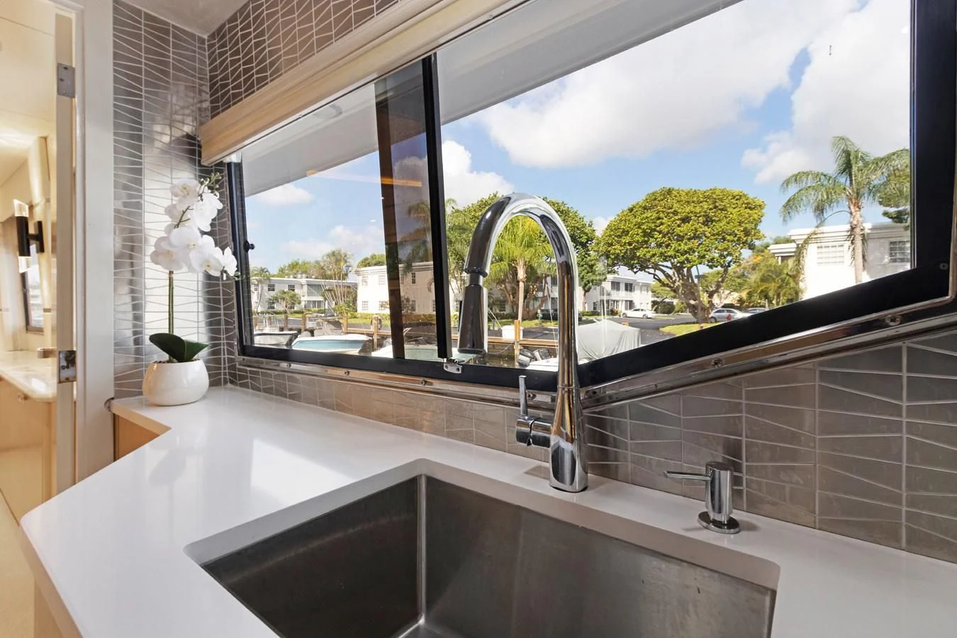 a large window with a view of a city aboard MARY KATHLENE Yacht for Sale