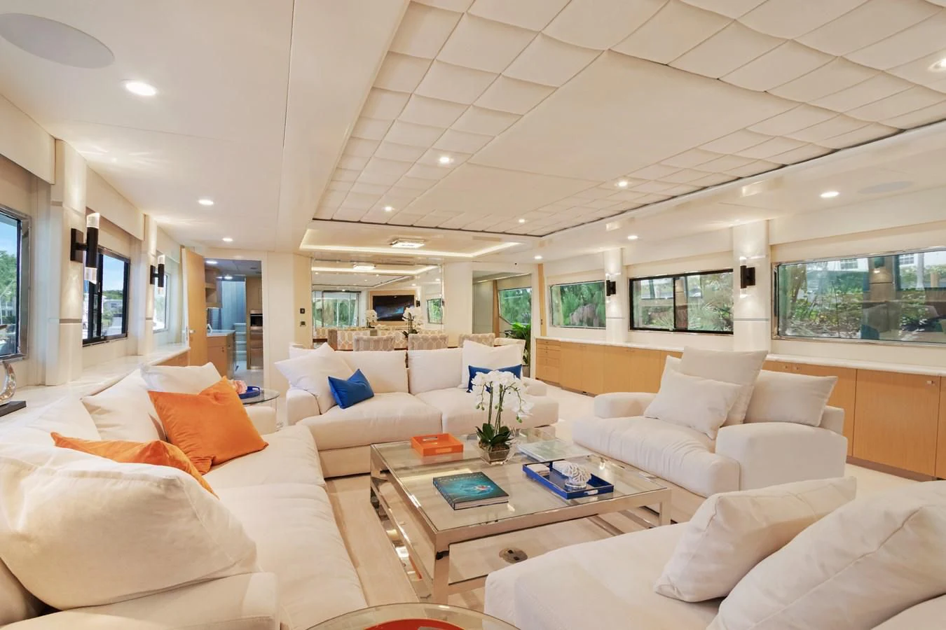 a living room with white couches aboard MARY KATHLENE Yacht for Sale