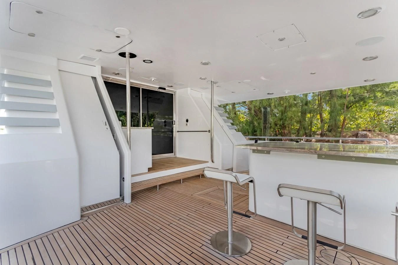 a white room with a deck and a pool aboard MARY KATHLENE Yacht for Sale