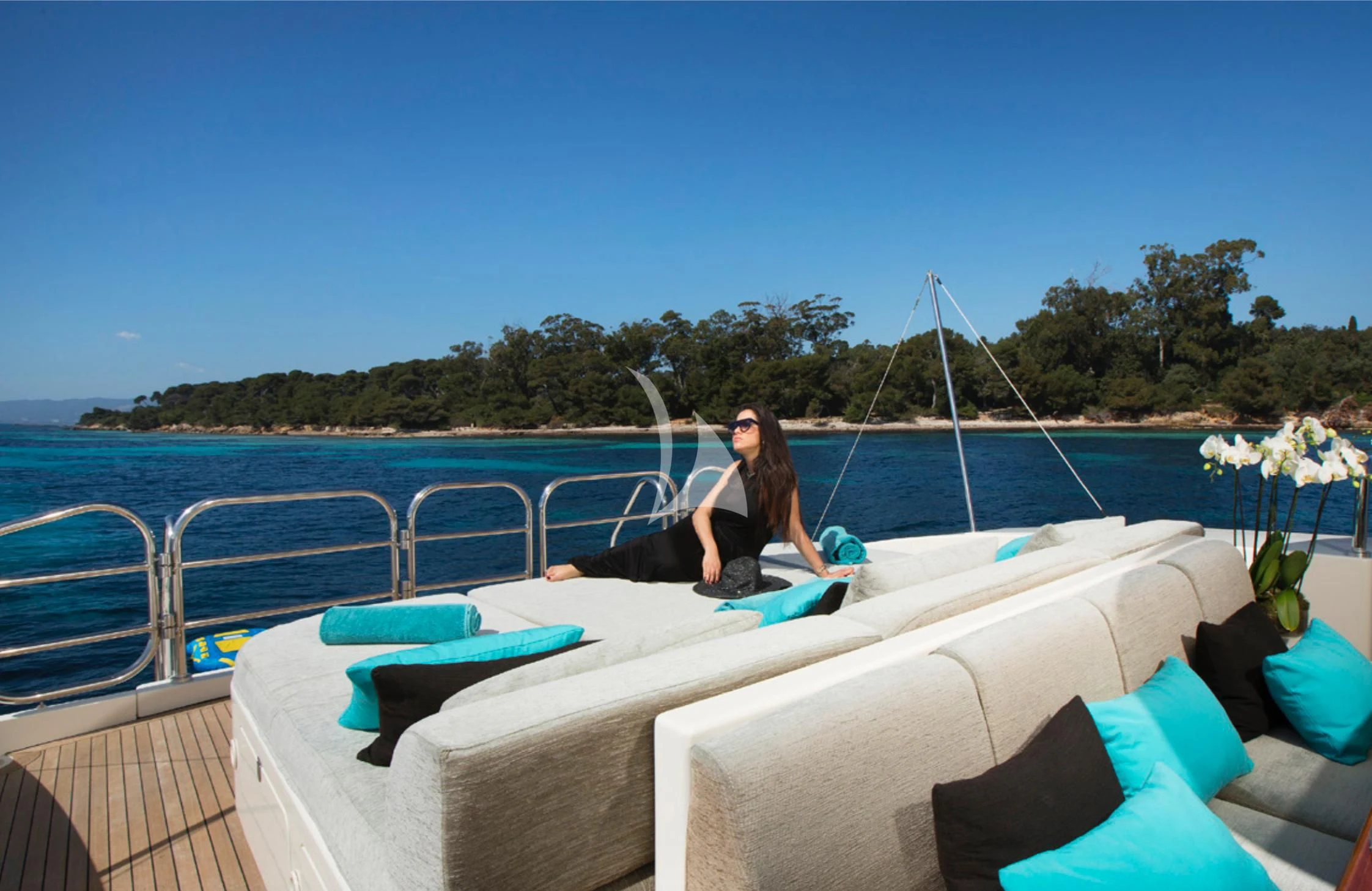 a person sitting on a lounge chair on a boat aboard EOL B Yacht for Sale