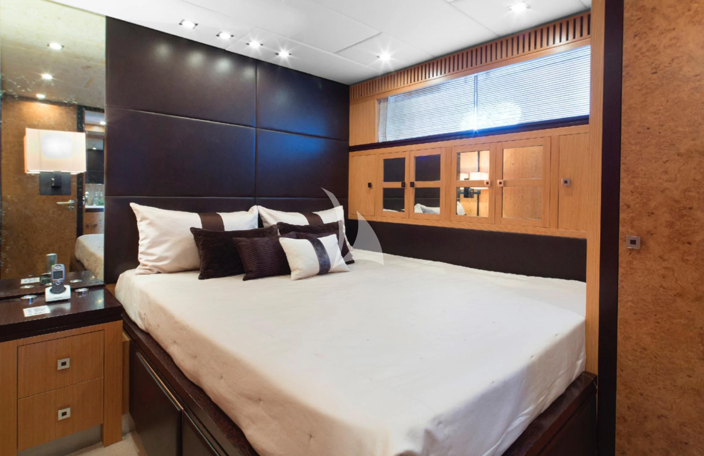 a room with a bed and a mirror aboard EOL B Yacht for Sale