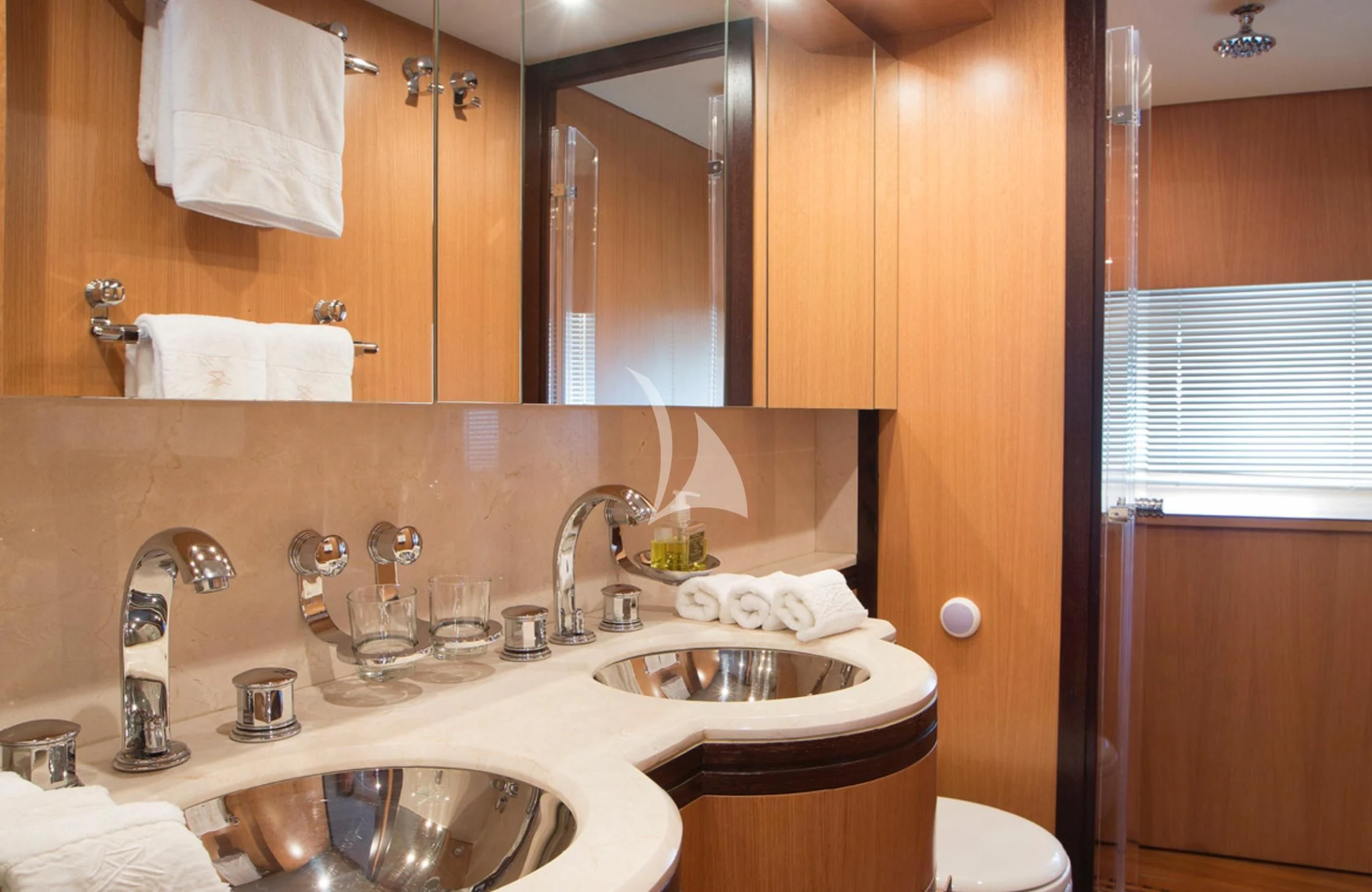 a bathroom with a sink and a mirror aboard EOL B Yacht for Sale