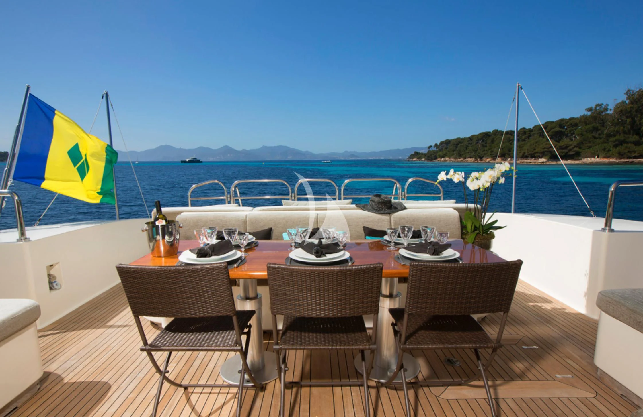 a table set for a meal on a beach aboard EOL B Yacht for Sale