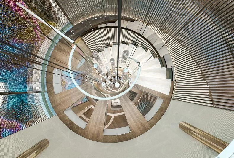 a spiral staircase with a spiral staircase aboard ETERNAL SPARK Yacht for Sale