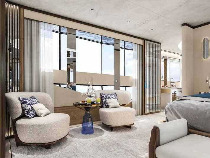 a room with a bed and a chair aboard ETERNAL SPARK Yacht for Sale