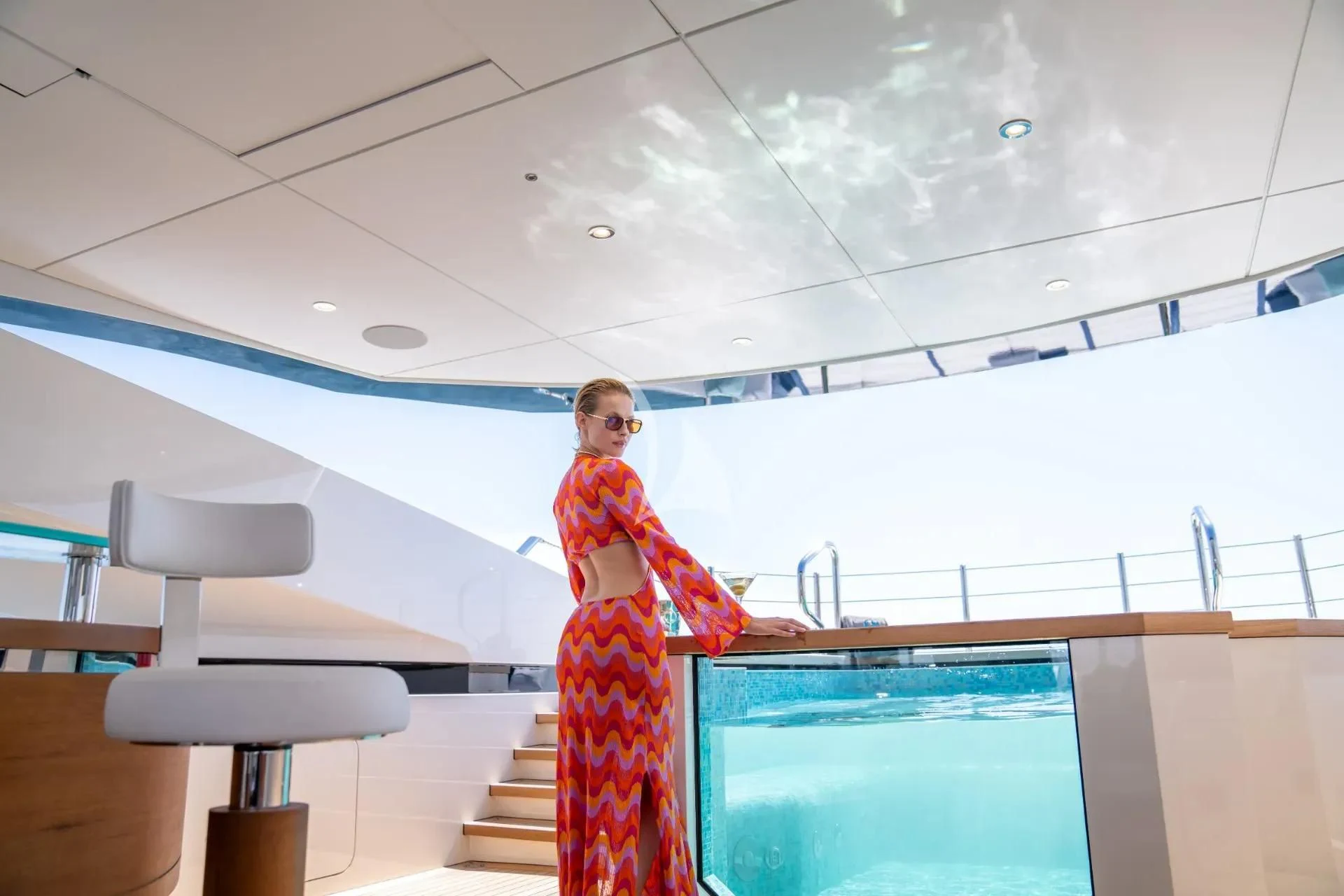 a person standing next to a projector screen aboard ETERNAL SPARK Yacht for Sale
