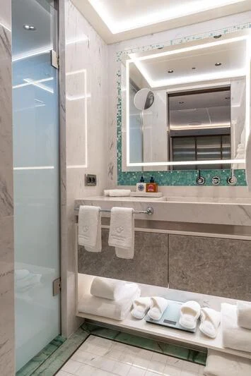 a bathroom with a glass shower aboard ETERNAL SPARK Yacht for Sale