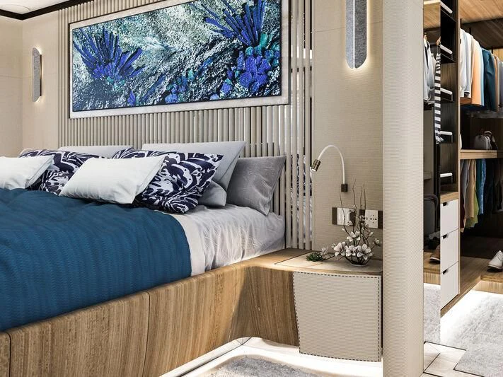 a bed with a blue pillow aboard ETERNAL SPARK Yacht for Sale