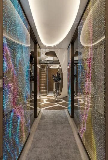 a hallway with a blue wall aboard ETERNAL SPARK Yacht for Sale