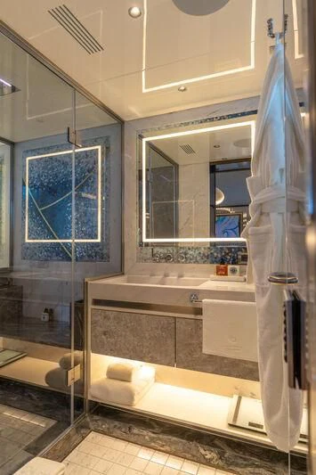 a bathroom with a large mirror aboard ETERNAL SPARK Yacht for Sale