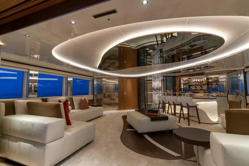 a room with white couches and a large window aboard ETERNAL SPARK Yacht for Sale