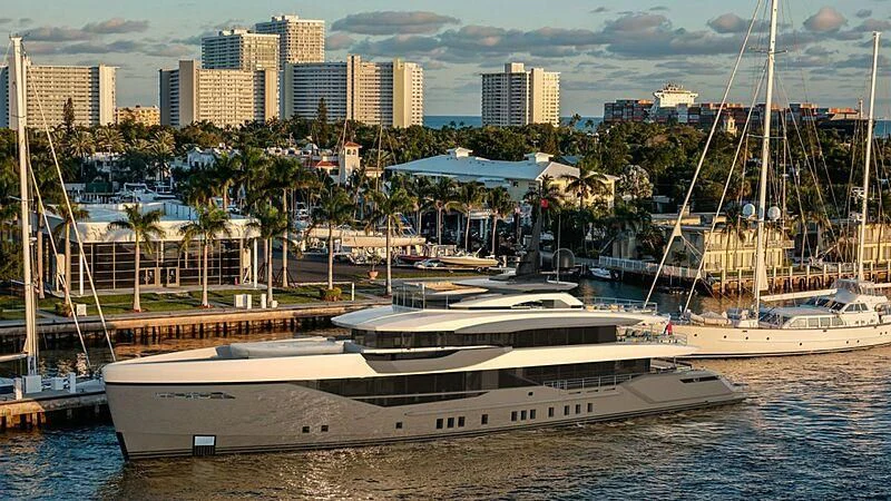a marina with boats and buildings in the background aboard ETERNAL SPARK Yacht for Sale