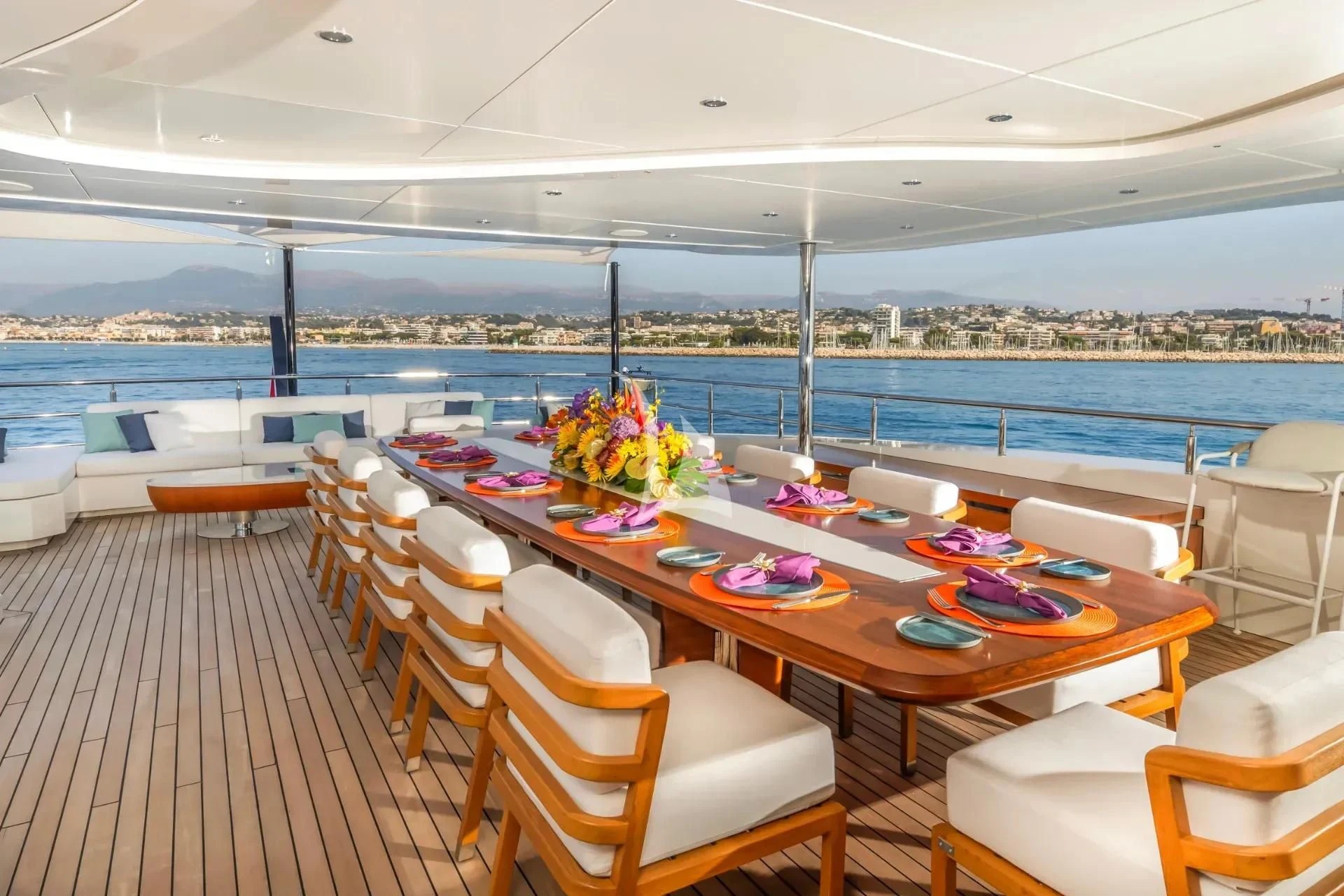 a room with tables and chairs aboard ETERNAL SPARK Yacht for Sale
