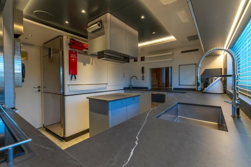 a kitchen with a large island aboard ETERNAL SPARK Yacht for Sale