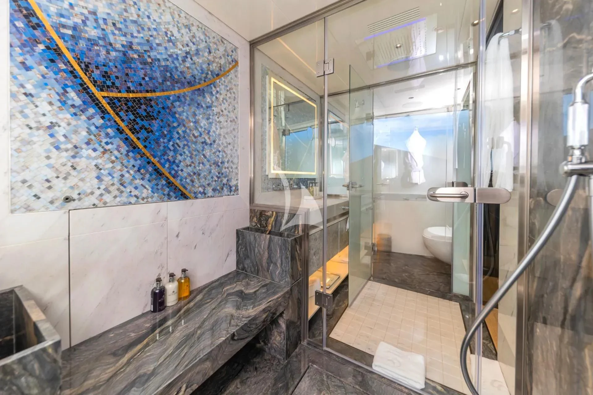a bathroom with a glass shower aboard ETERNAL SPARK Yacht for Sale