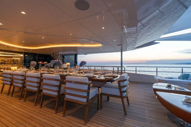 a restaurant with tables and chairs aboard ETERNAL SPARK Yacht for Sale