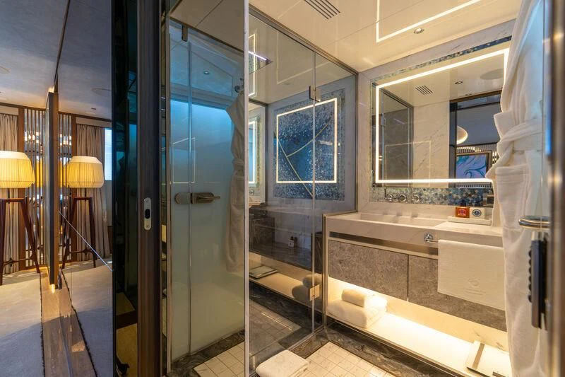 a bathroom with a glass shower aboard ETERNAL SPARK Yacht for Sale