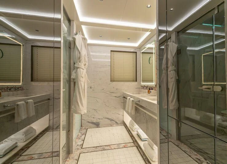 a bathroom with glass doors aboard ETERNAL SPARK Yacht for Sale