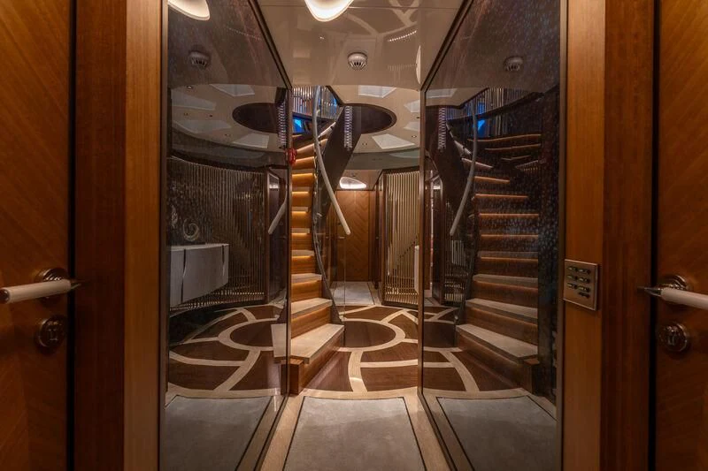 a hallway with glass doors aboard ETERNAL SPARK Yacht for Sale
