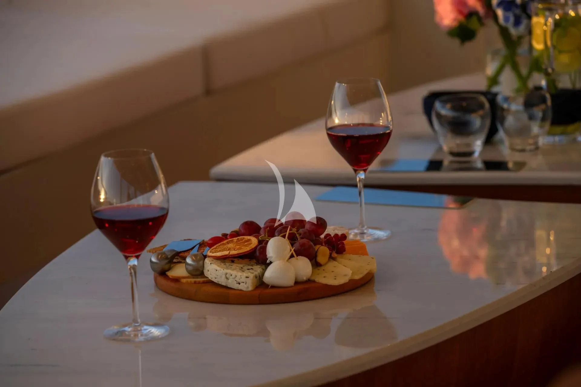 a plate of food and wine aboard ETERNAL SPARK Yacht for Sale