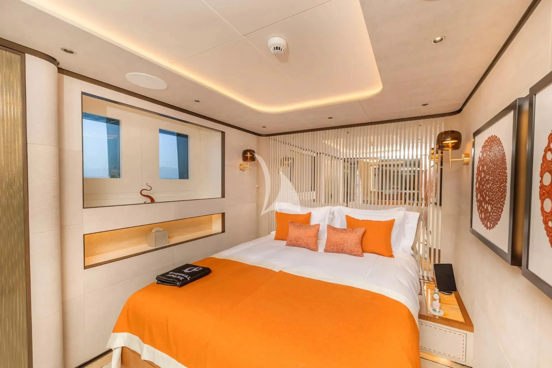 a bedroom with a bed and a tv on the wall aboard ETERNAL SPARK Yacht for Sale