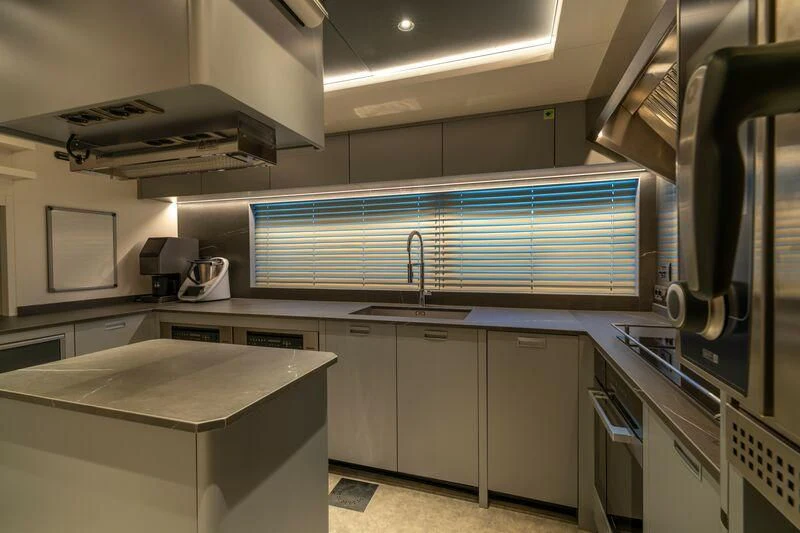a kitchen with white cabinets aboard ETERNAL SPARK Yacht for Sale