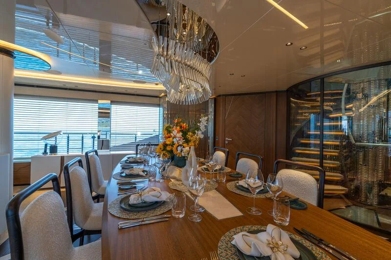 a dining room with a table set aboard ETERNAL SPARK Yacht for Sale
