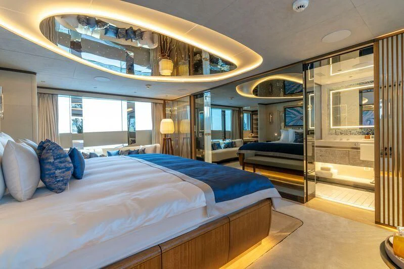 a room with a bed and a mirror aboard ETERNAL SPARK Yacht for Sale