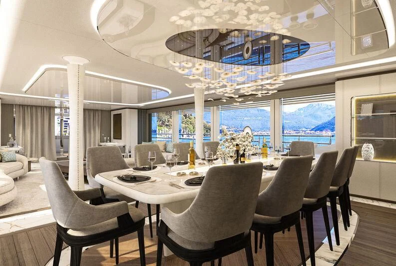 a room with tables and chairs aboard ETERNAL SPARK Yacht for Sale