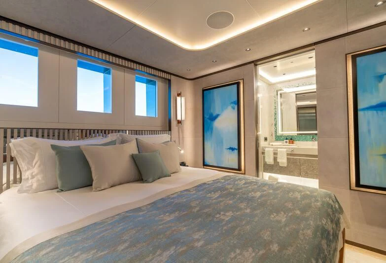 a bed with white sheets aboard ETERNAL SPARK Yacht for Sale