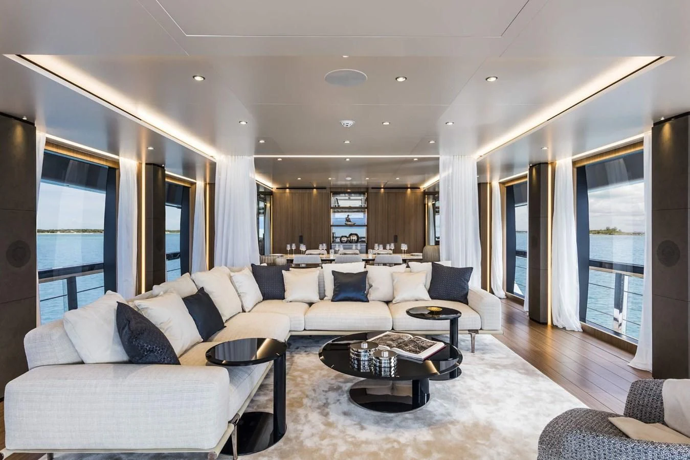 a living room with a large window aboard CARMA Yacht for Sale