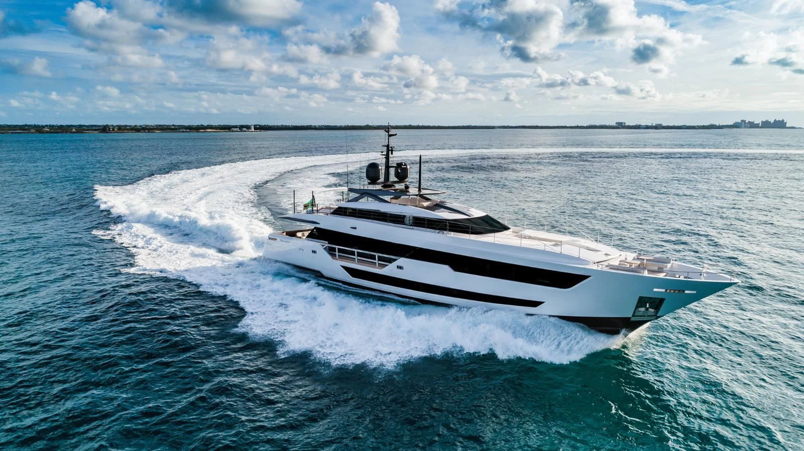 a white boat on water aboard CARMA Yacht for Sale