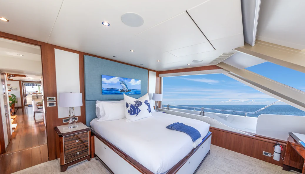 a room with a bed and a television aboard DRINKABILITY Yacht for Sale