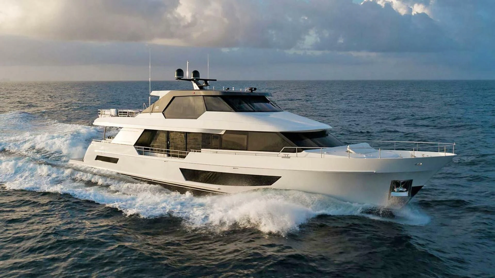 a white yacht on the water aboard DRINKABILITY Yacht for Sale