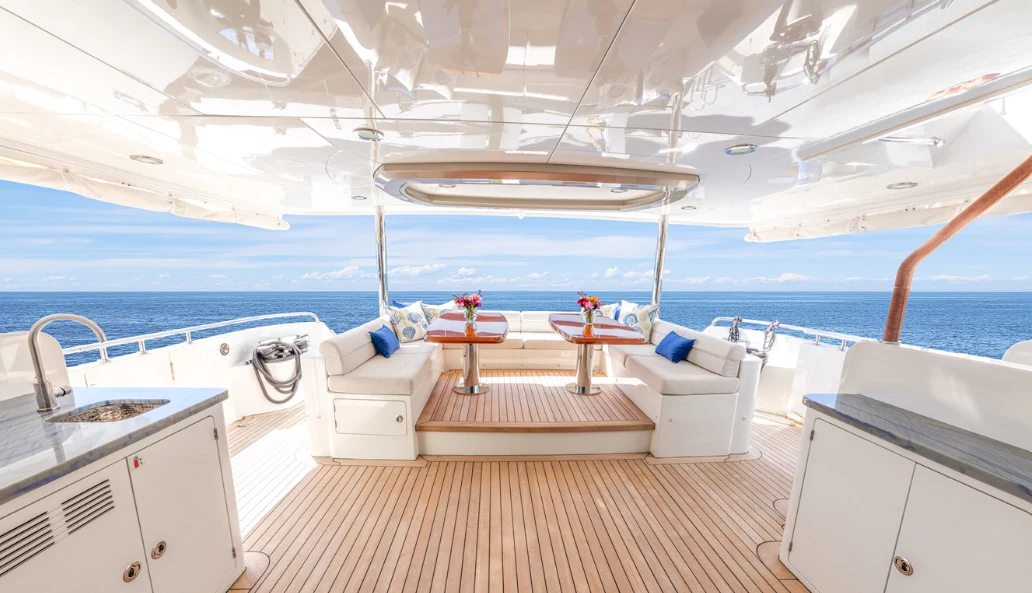 a room with a view of the ocean and a deck aboard DRINKABILITY Yacht for Sale