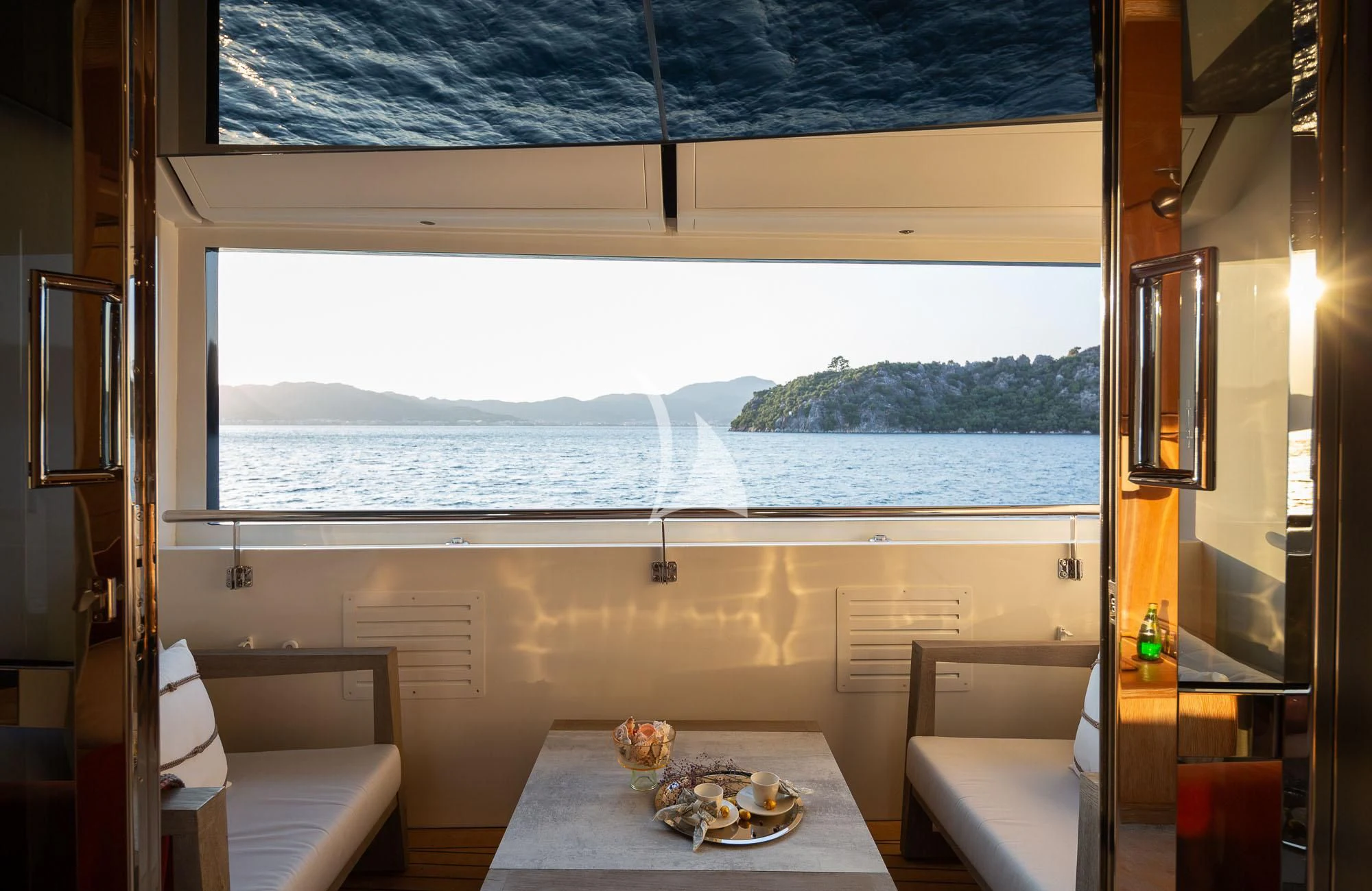 a room with a table and chairs aboard LADY I Yacht for Charter
