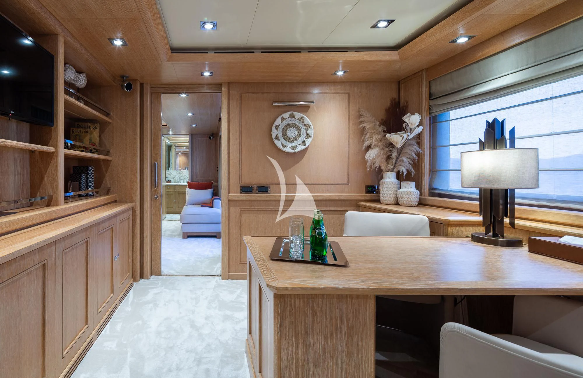 a room with a desk and a lamp aboard LADY I Yacht for Charter