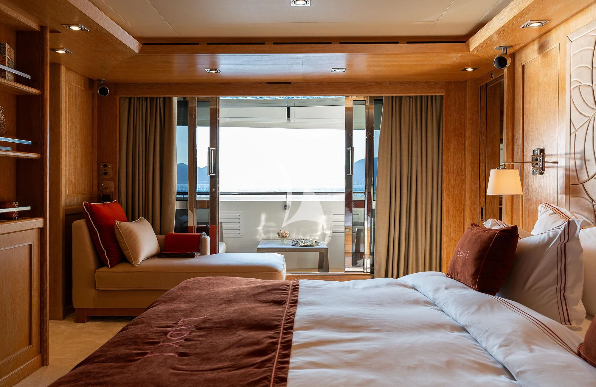 a hotel room with a bed and a window aboard LADY I Yacht for Charter