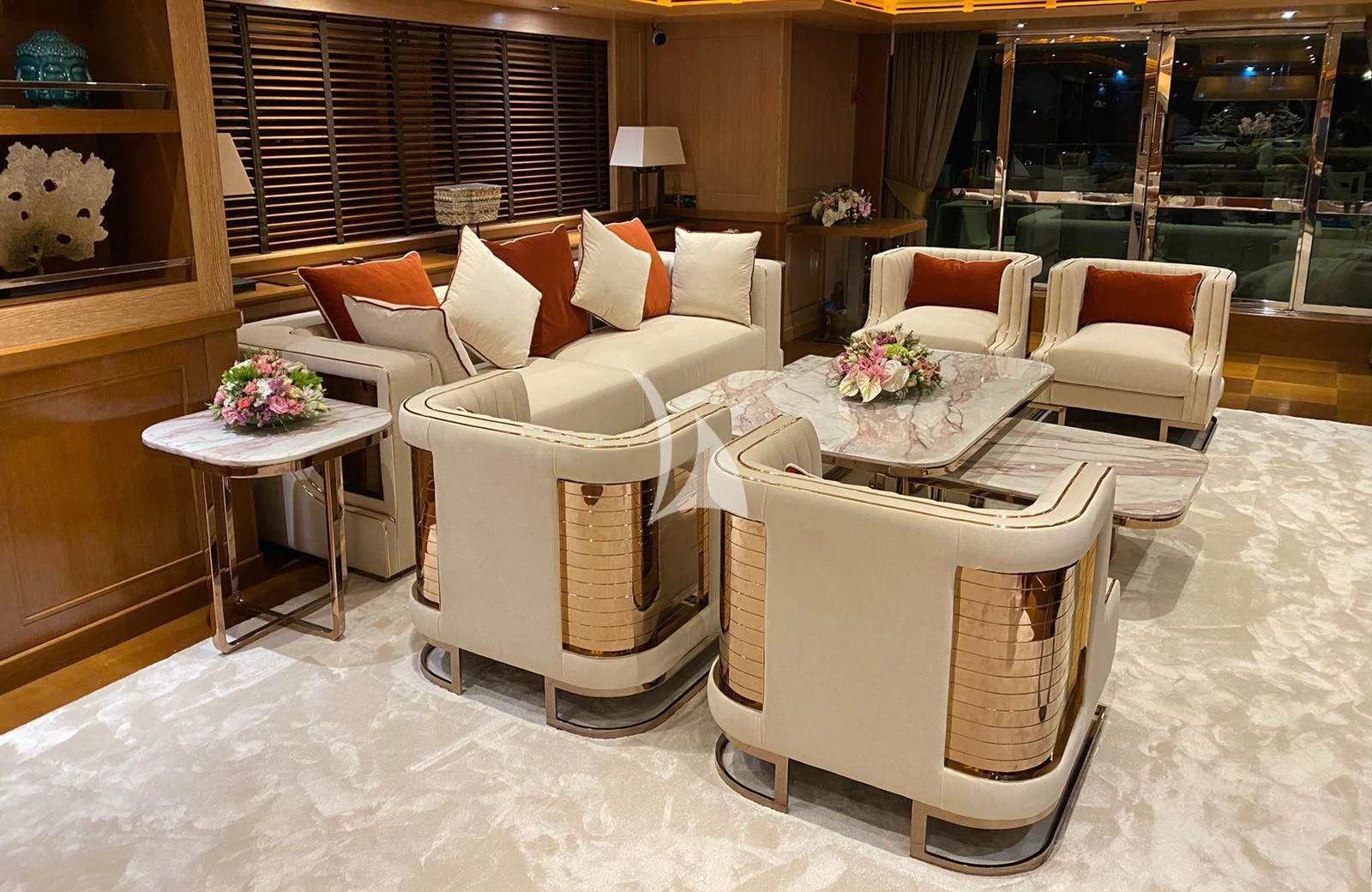 a living room with a white chair and a table aboard LADY I Yacht for Charter
