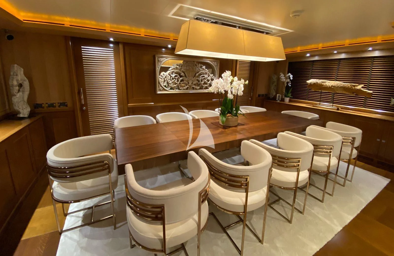 a dining room with white chairs aboard LADY I Yacht for Charter