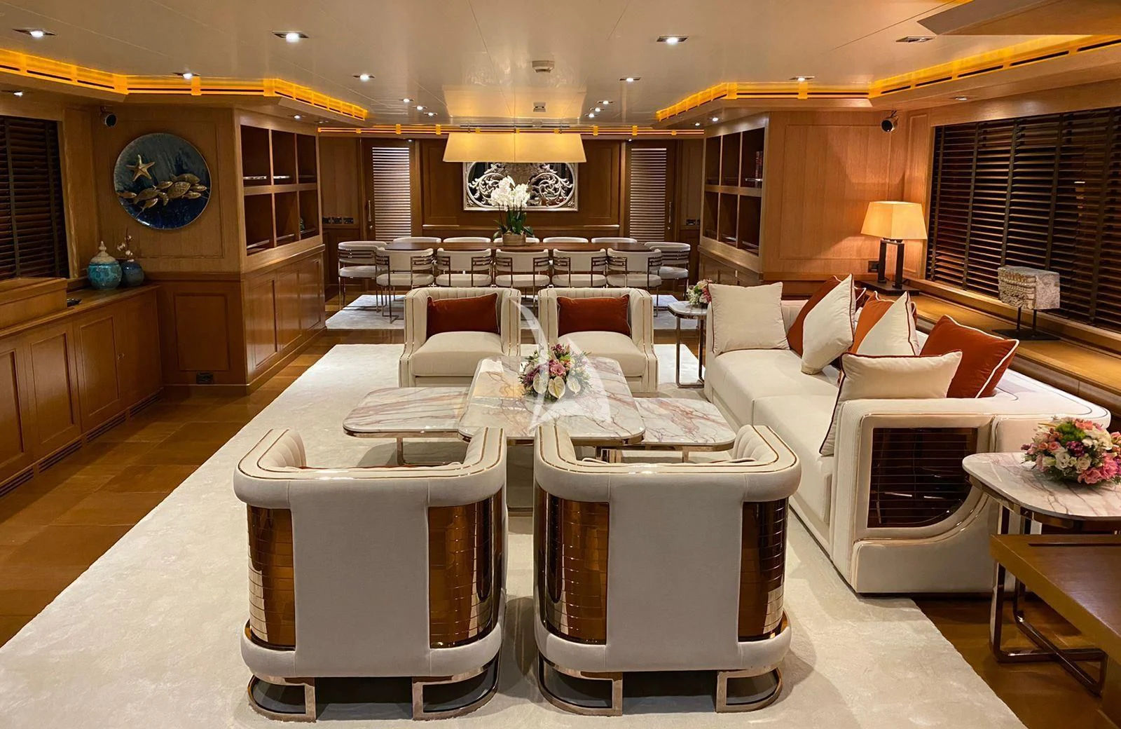 a large living room with a large table and chairs aboard LADY I Yacht for Charter