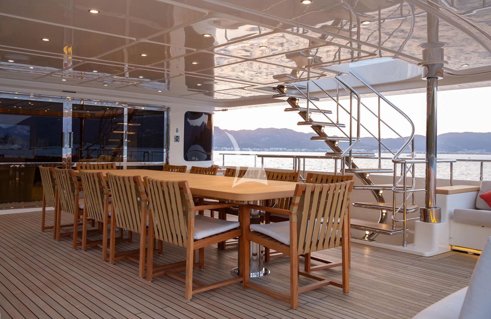 a room with tables and chairs aboard LADY I Yacht for Charter