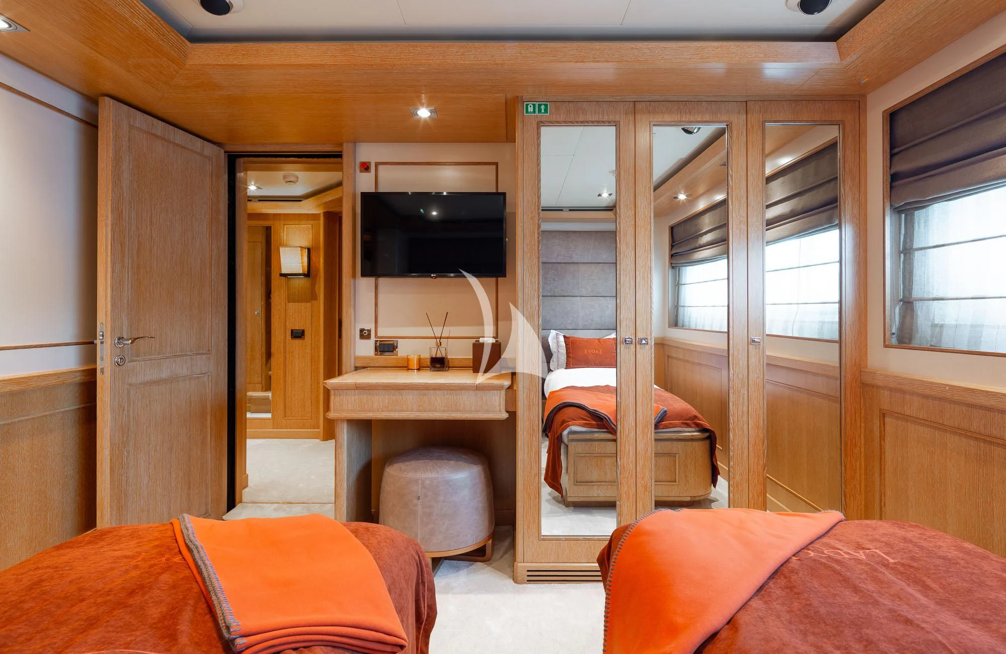a bedroom with a bed and a desk aboard LADY I Yacht for Charter