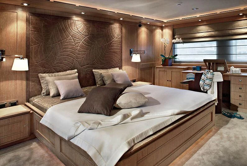 a bed in a room aboard LADY I Yacht for Charter