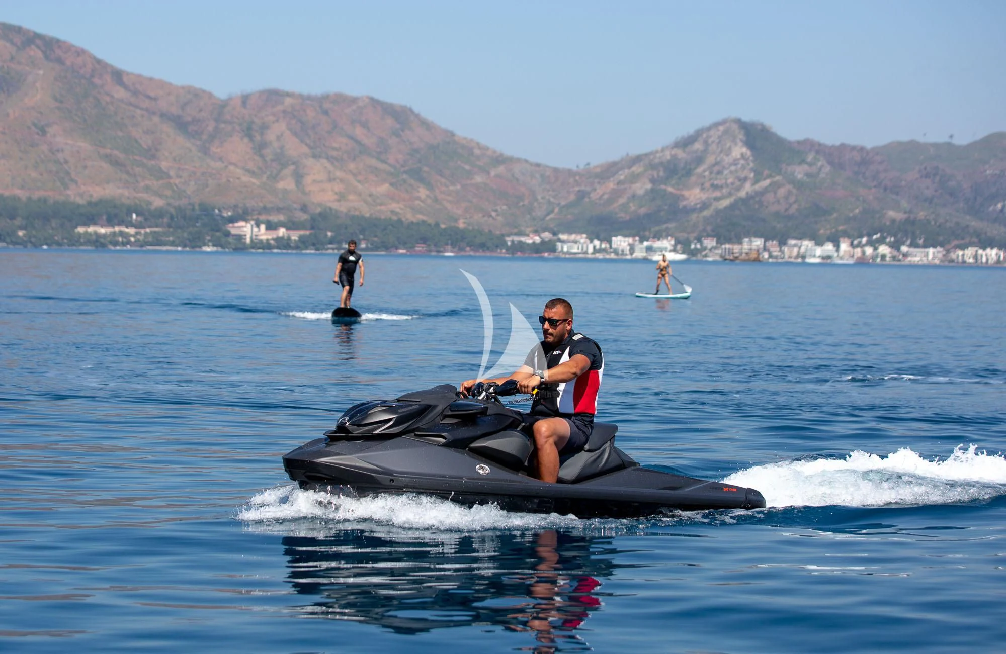 a man on a jet ski aboard LADY I Yacht for Charter