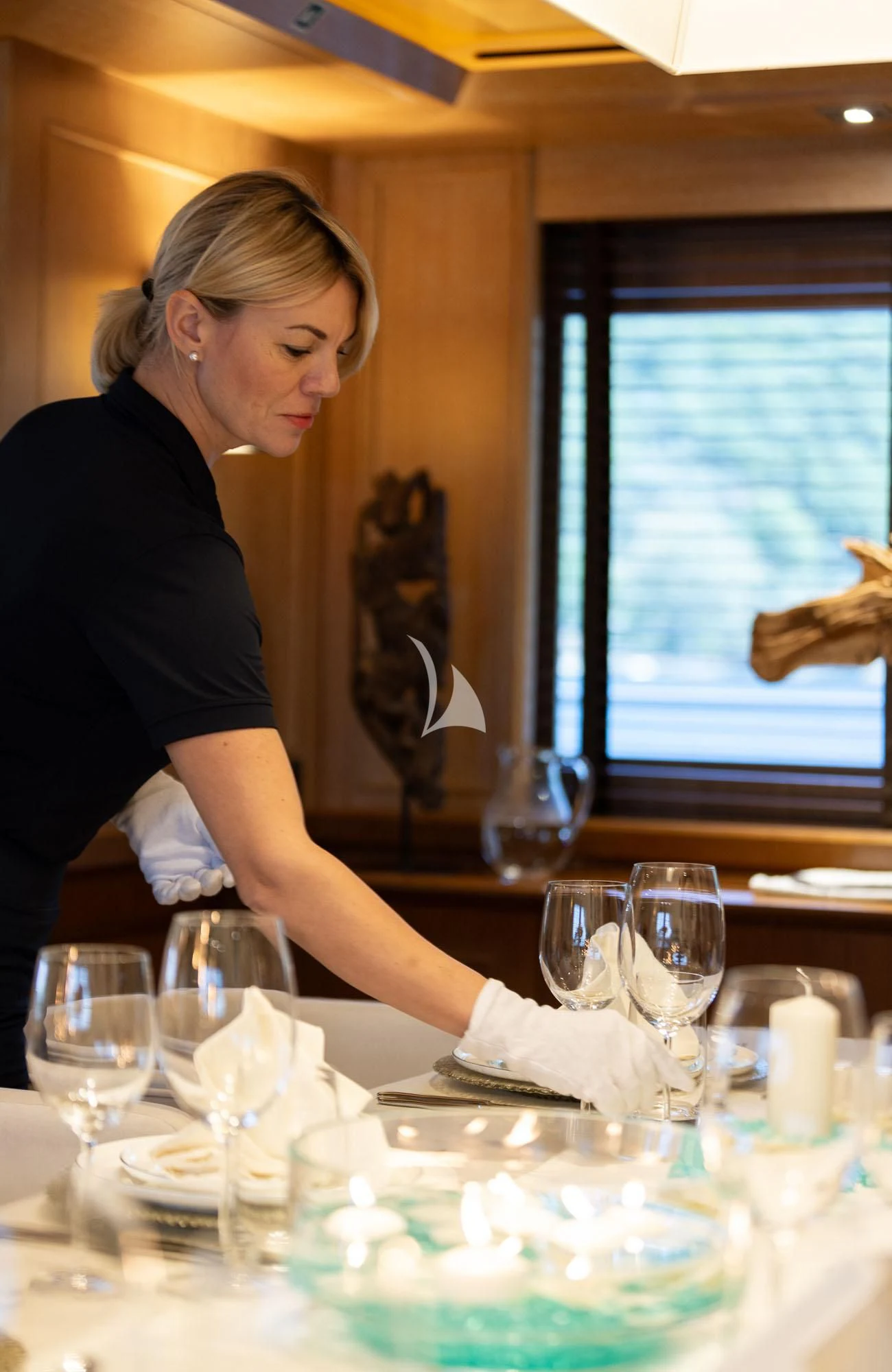 a person sitting at a table aboard LADY I Yacht for Charter